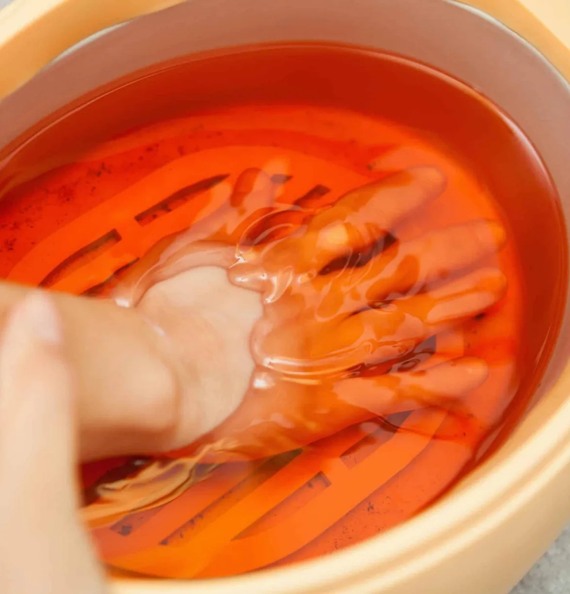 Paraffin wax therapy for hand pain relief. Physical therapy rehab treatment to improve mobility and function at our clinic