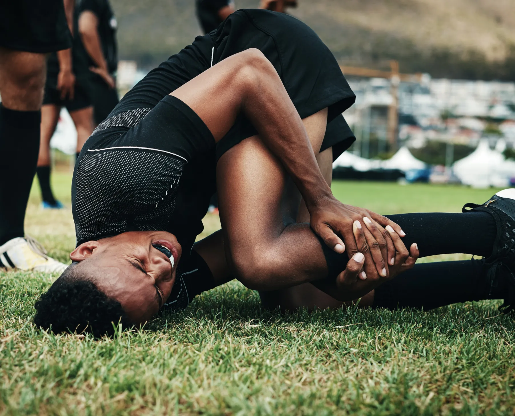 Knee pain after sports injury. Physical therapy for rehab treatment, pain relief, and mobility recovery at our clinic