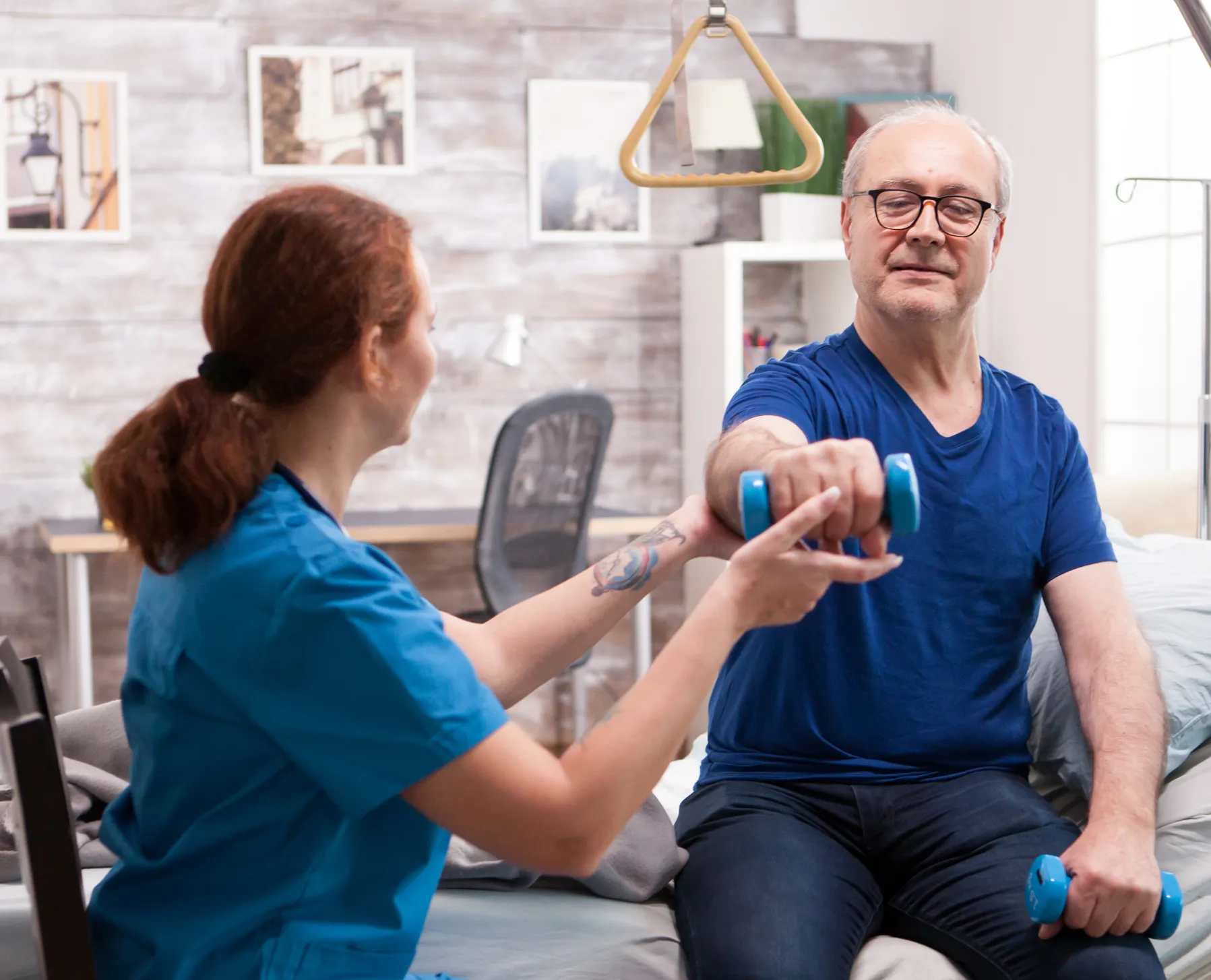 Stroke rehabilitation physical therapy: Patient lifting weights for mobility recovery and improved function