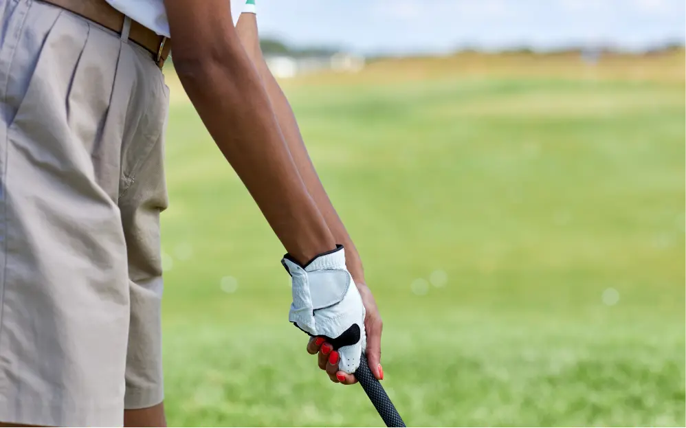 Golfer with elbow pain. Physical therapy for medial epicondylitis. Rehab treatment for pain relief & mobility recovery. Sports injury recovery.